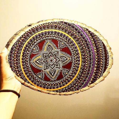 5 X 11 wood slice mandala drawn with black pen and colored in with burgundy, purple, yellow, metallic purple, and dark purple marker, adorned with red, purple, and gold paint dots. 

SOLD OUT!!