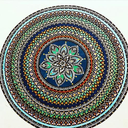11 X 14 mandala drawn with black ink and colored with dark and light blue, green, and reddish brown, finished with golden paint dots. 

This item comes with a frame. 

Price: $250