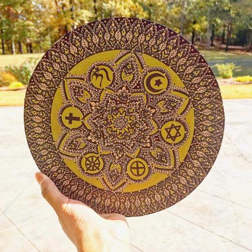 7 X 7 wood circle mandala drawn in with black pen and colored with metallic gold. Surrounding circles represent several religious symbols all encompassed in the same mandala. 

SOLD OUT! 
