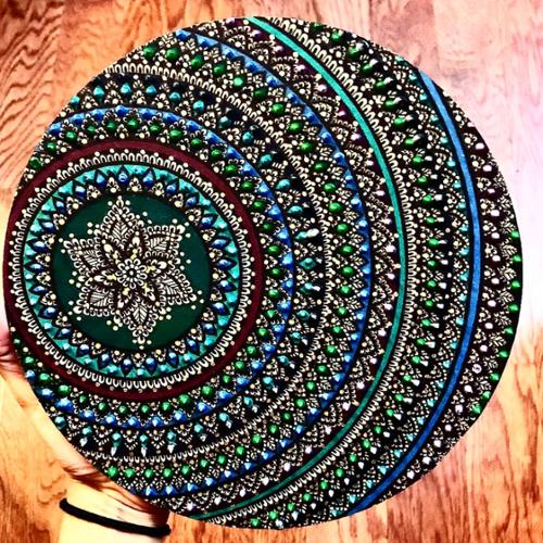 7 X 7 wood circle mandala. Drawn in with black pen, colored in with burgundy, blue, teal, and green marker, adorned with blue, green, and teal paint dots. 

SOLD OUT! 