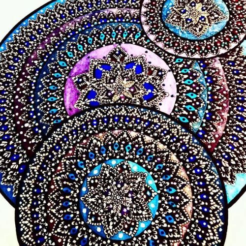 9 X 12 triple mandala drawn with black ink, colored with purple, gold, light blue, dark blue, and violet metallic pens, designed with white paint dots. 

SOLD OUT! 